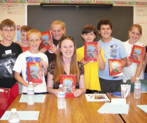 Naomi and kids with books